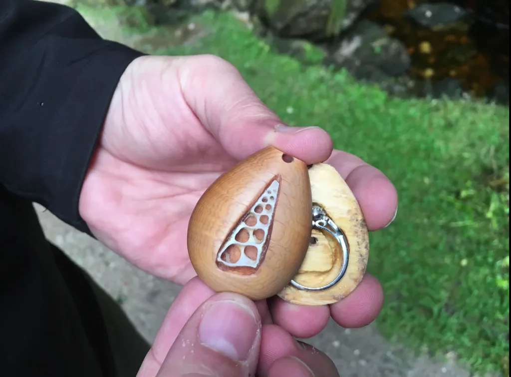 The engagement ring was hidden in a special slot in the necklace.