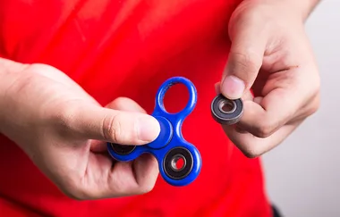A boy has been rushed to hospital after swallowing part of a fidget spinner