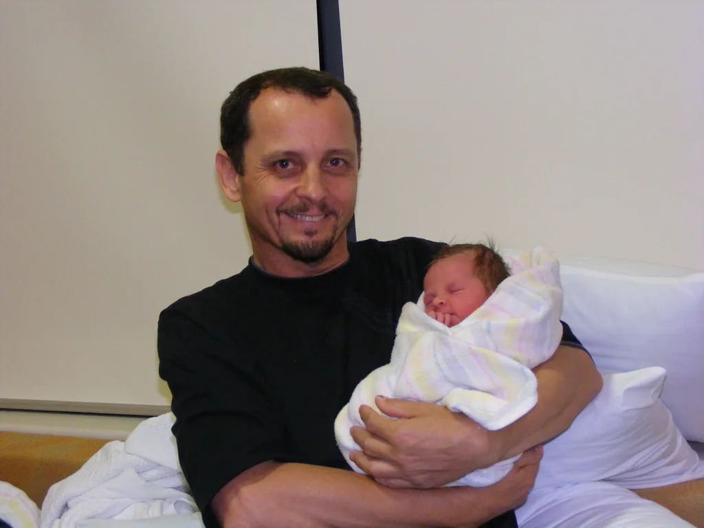 Harry with Selena the day she was born