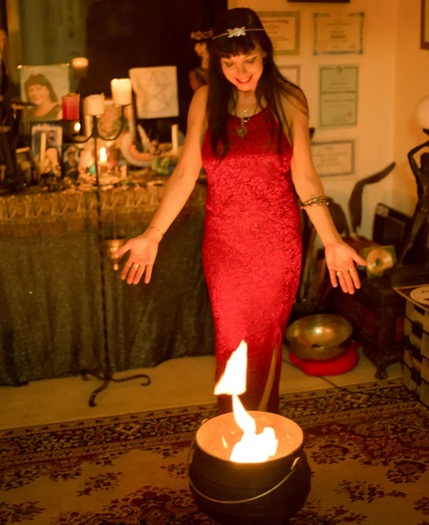 Suburban witch Mara Carter casts a spell using fire