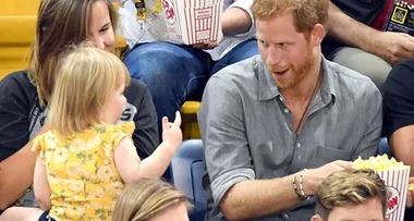 These photos of a toddler stealing Prince Harry’s popcorn will make your day
