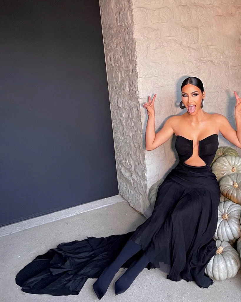 Kim Kardashian in a black jersey wedding guest dress