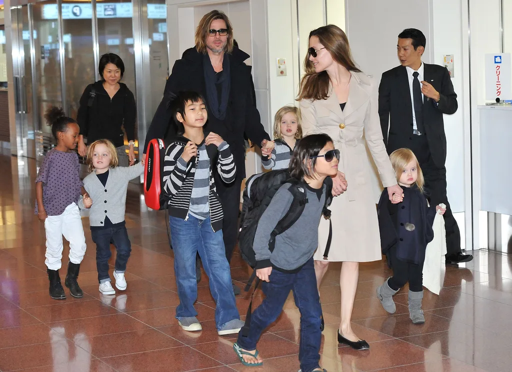 Brad Pitt, Angelina Jolie and their six children Maddox, Pax, Zahara, Shiloh, Knox, and Vivienne arrive at Haneda International Airport.