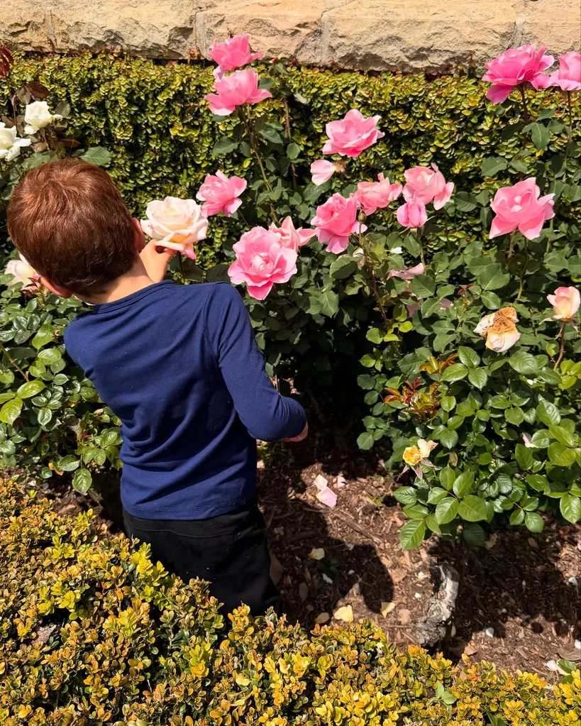 Archie Sussex plays in the garden