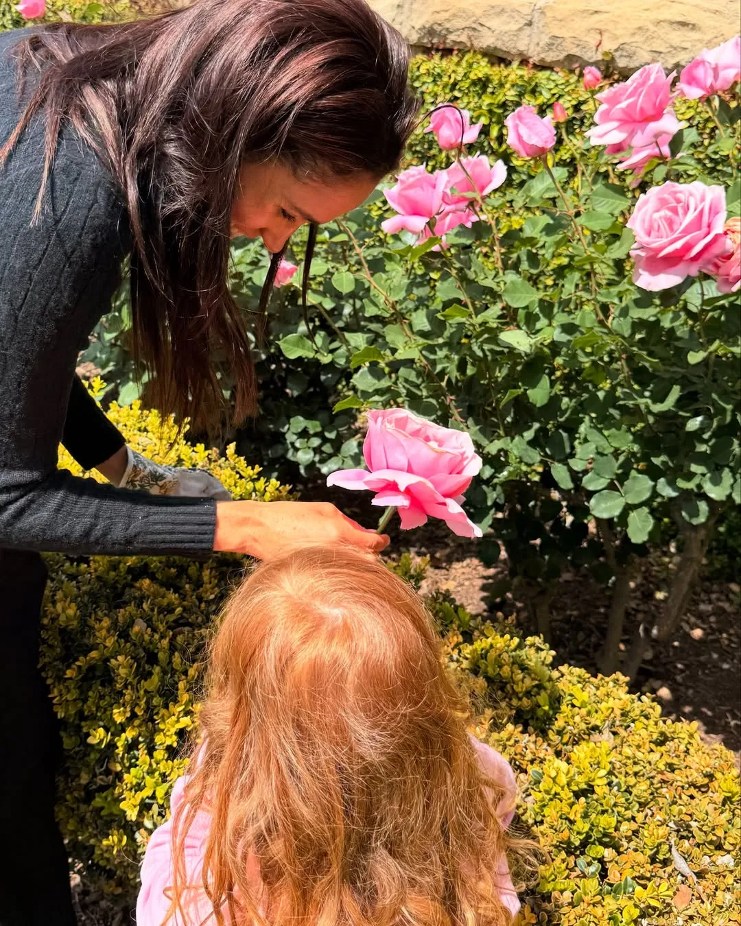 Meghan Markle and Lilibet Sussex in the garden 