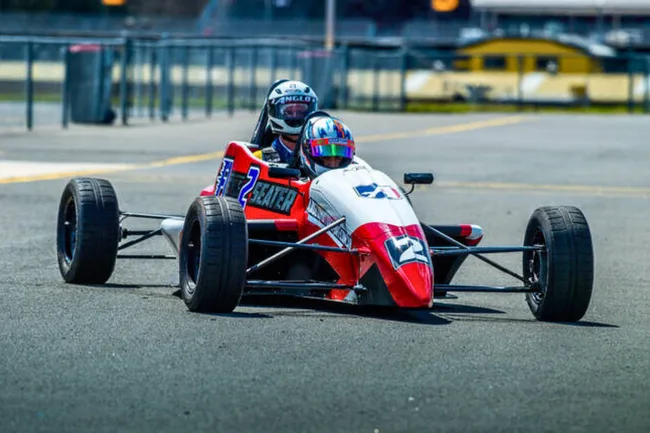 F1-style car with two seats.