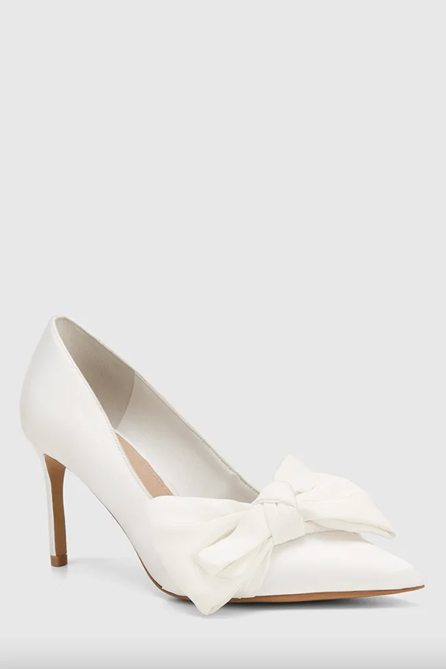 White pump with bow.