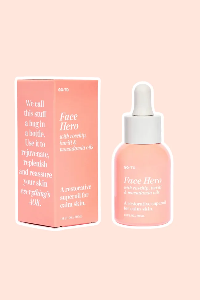 Go-To Skincare's Face Hero face oil on a peach coloured background.