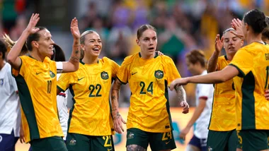 MELBOURNE, AUSTRALIA - DECEMBER 04: Sharn Freier of Australia celebrates with team mates after scoring a goalduring the International Friendly match between Australia Matildas and Chinese Taipei at AAMI Park on December 04, 2024 in Melbourne, Australia.