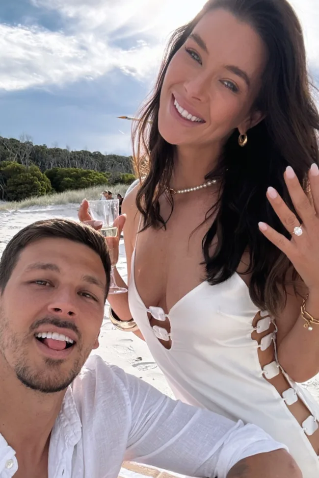Brittany Hockley wearing an engagement ring alongside fiance Benjamin Siegrist