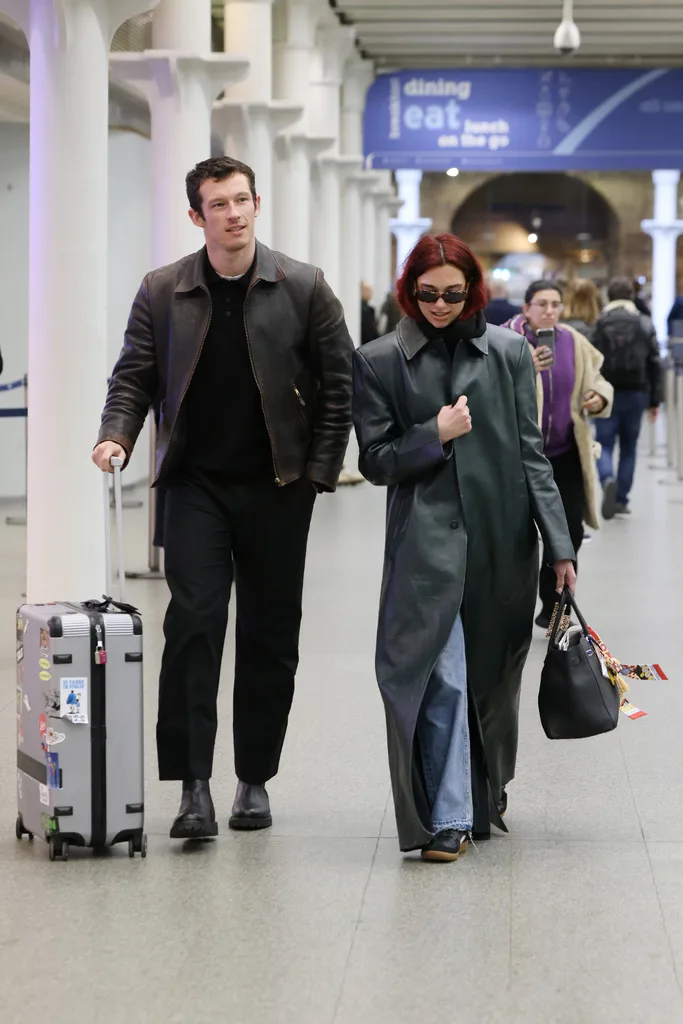 Dua Lipa and Callum Turner at London's Kings Cross St Pancras station.