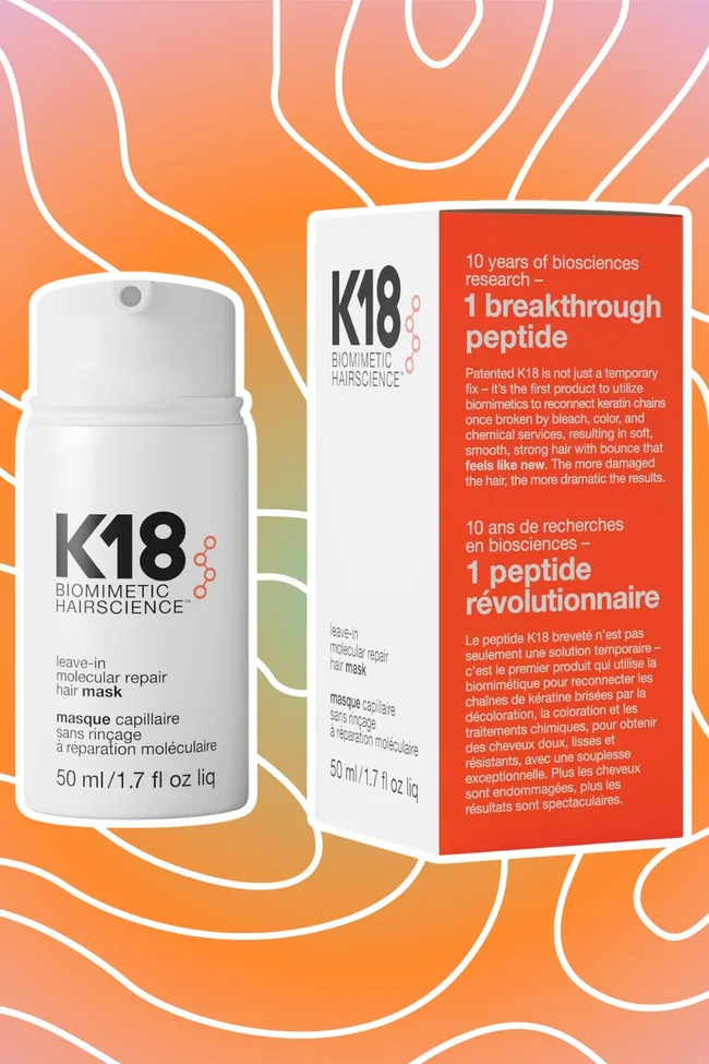 K18 Biomimetic Hairscience leave-in molecular repair hair mask and box with vibrant wavy background.