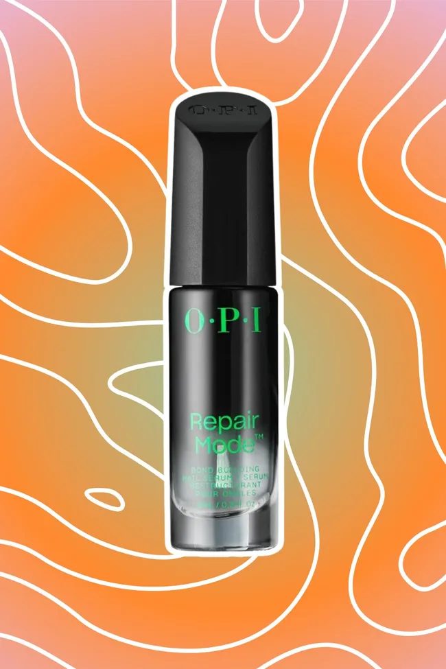 OPI Repair Mode nail serum bottle on a vibrant orange and pink abstract background.