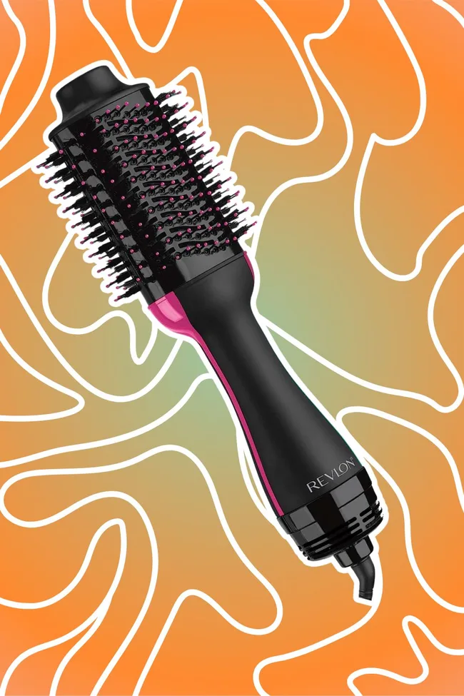 Revlon hair dryer brush with pink accents on an orange abstract background.