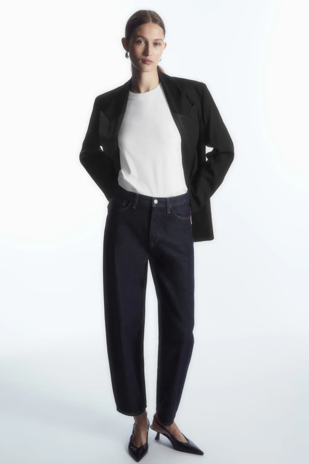 Model wearing Cos jeans