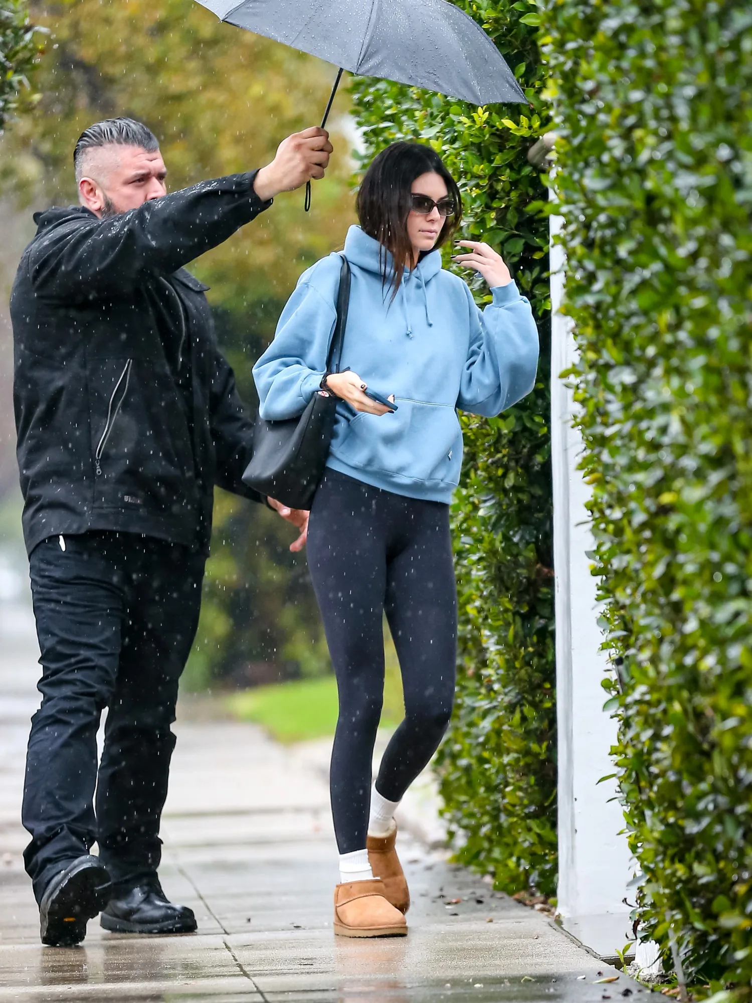 Kendall Jenner wearing slipper boots and activewear