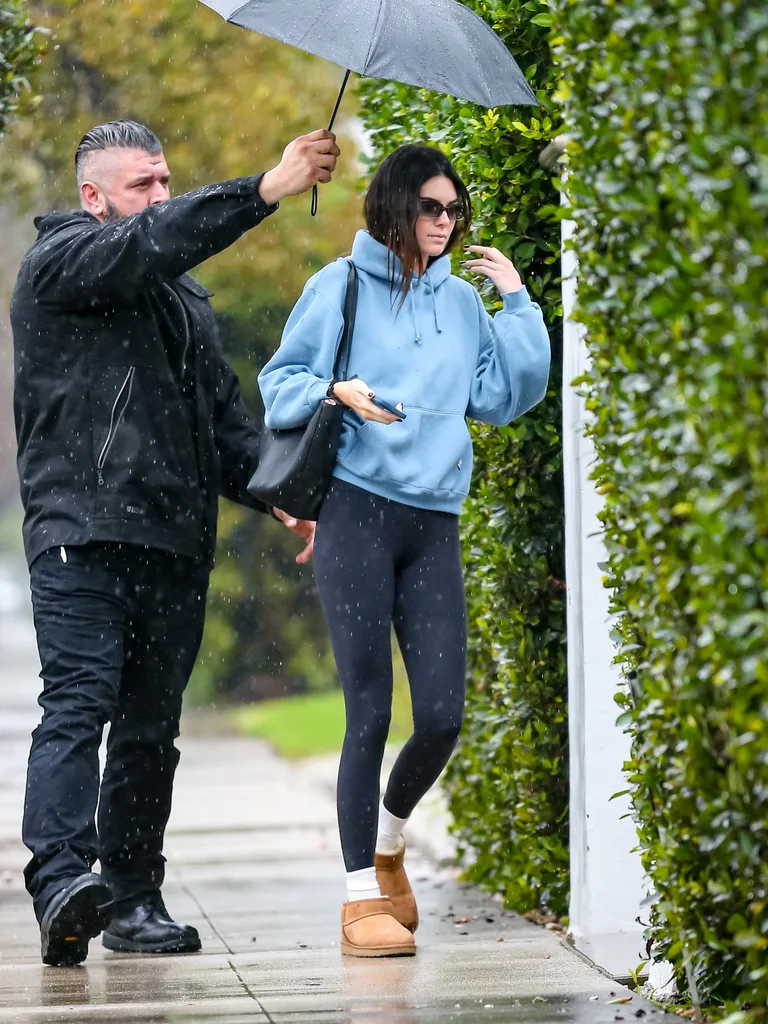 Kendall Jenner wearing slipper boots and activewear