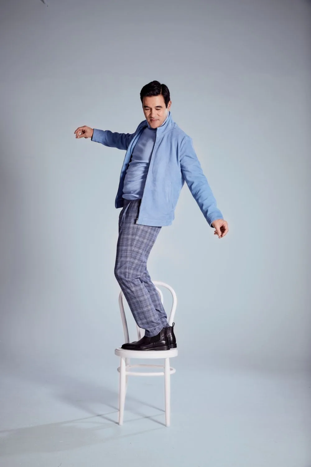 James Stewart on chair photoshoot