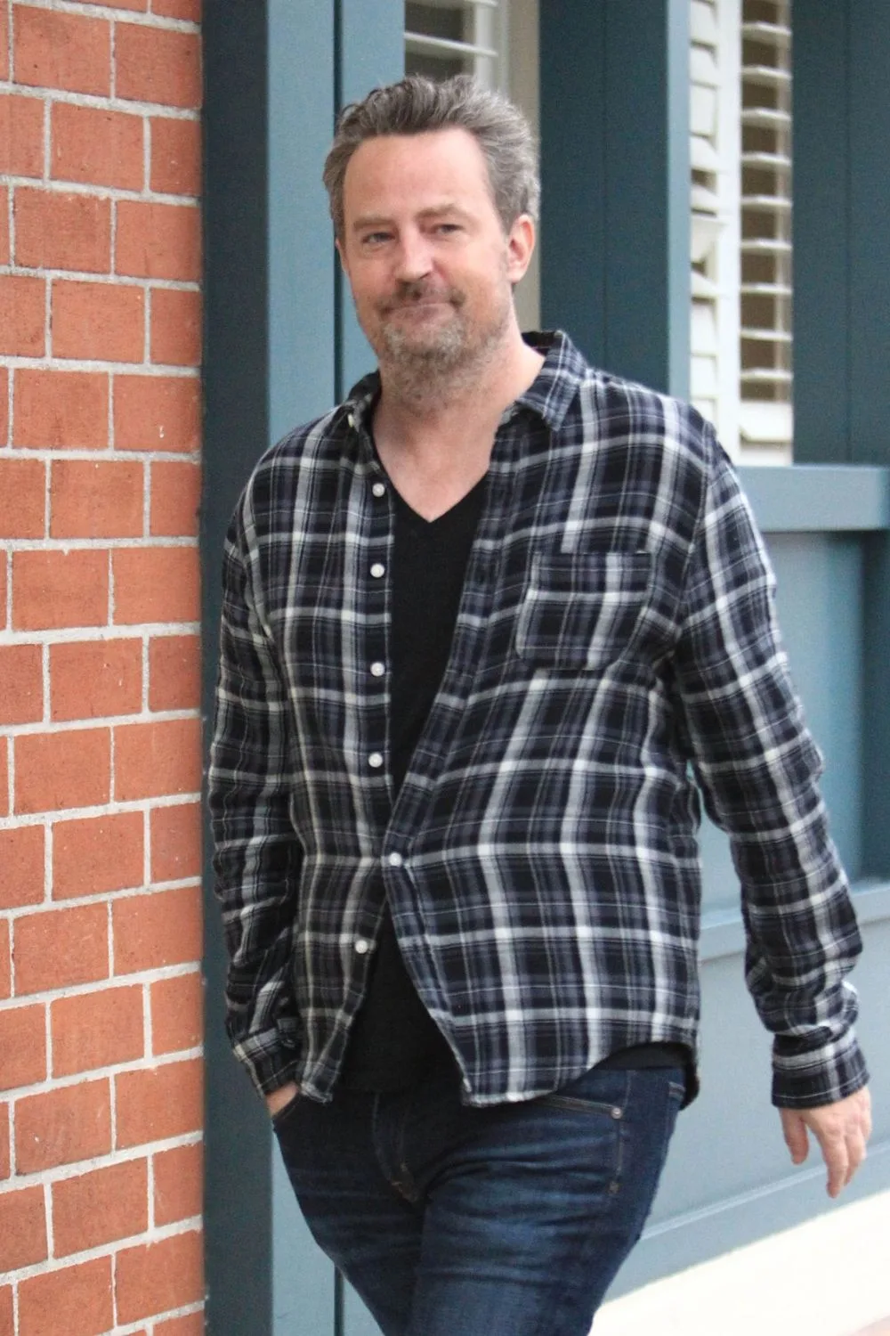 Matthew Perry walking.