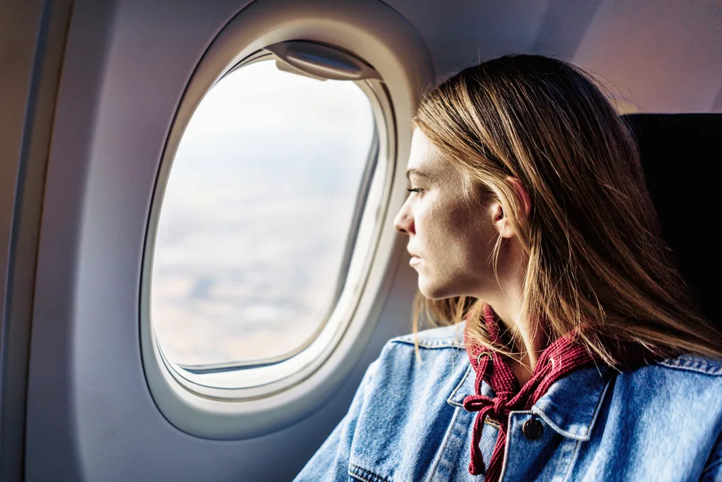 Women by plane looking out the window