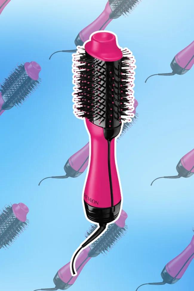 Pink Revlon One-Step Hair Dryer and Volumizer on blue background with pattern.