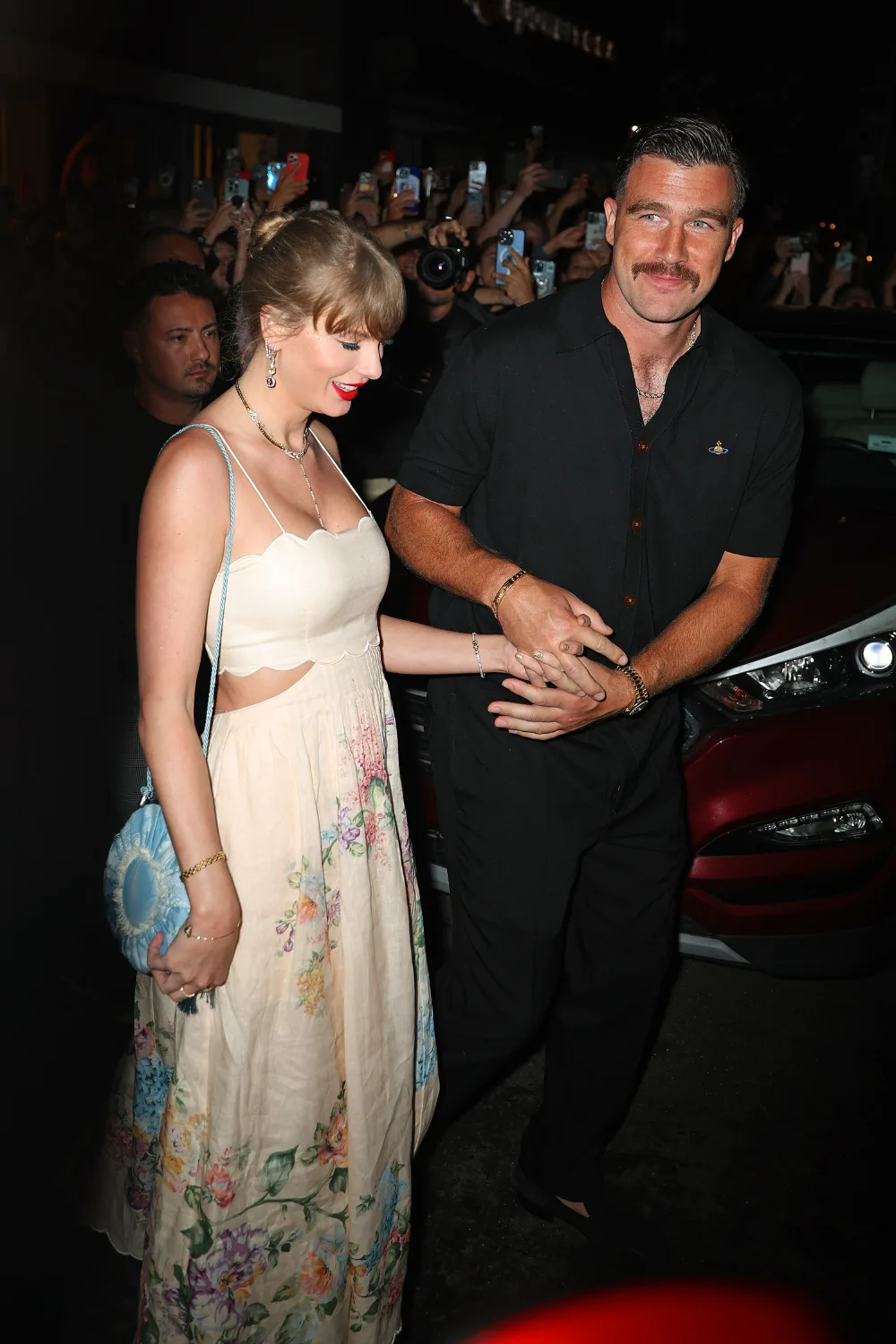 Taylor Swift and Travis Kelce attending Karen Elson's wedding.