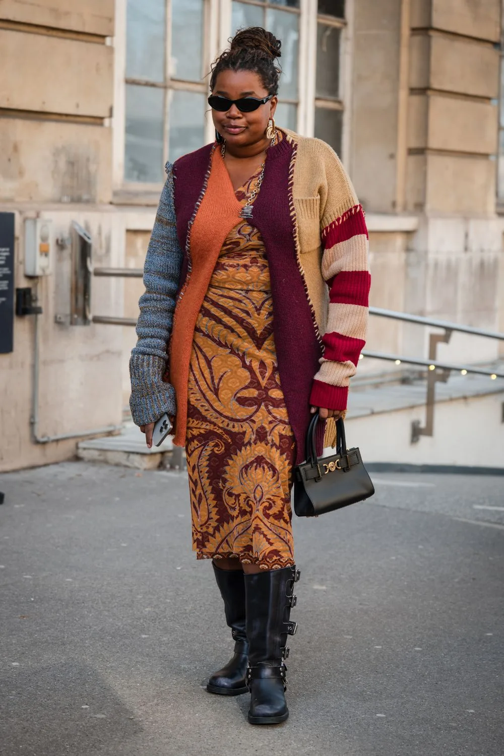 Street Style Person wearing orange dress and boots