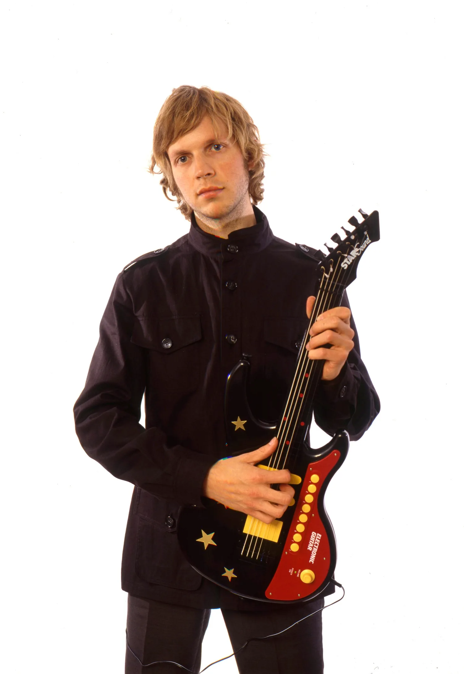 Beck with a guitar.