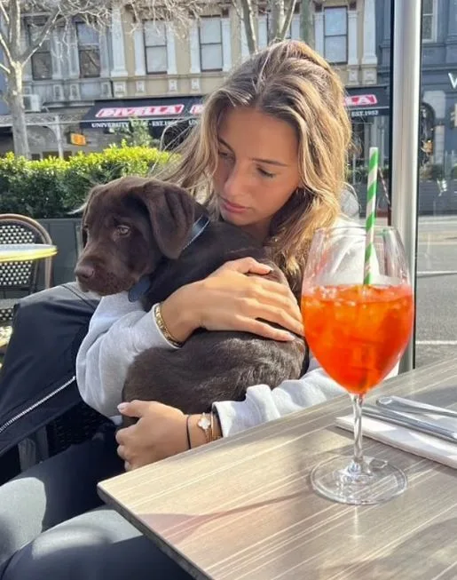 Eve Markoski holding Ben Silvagni's puppy on Instagram story