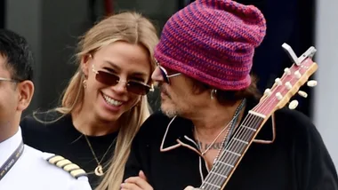 Yulia Vlasova and Johnny Depp looking cosy