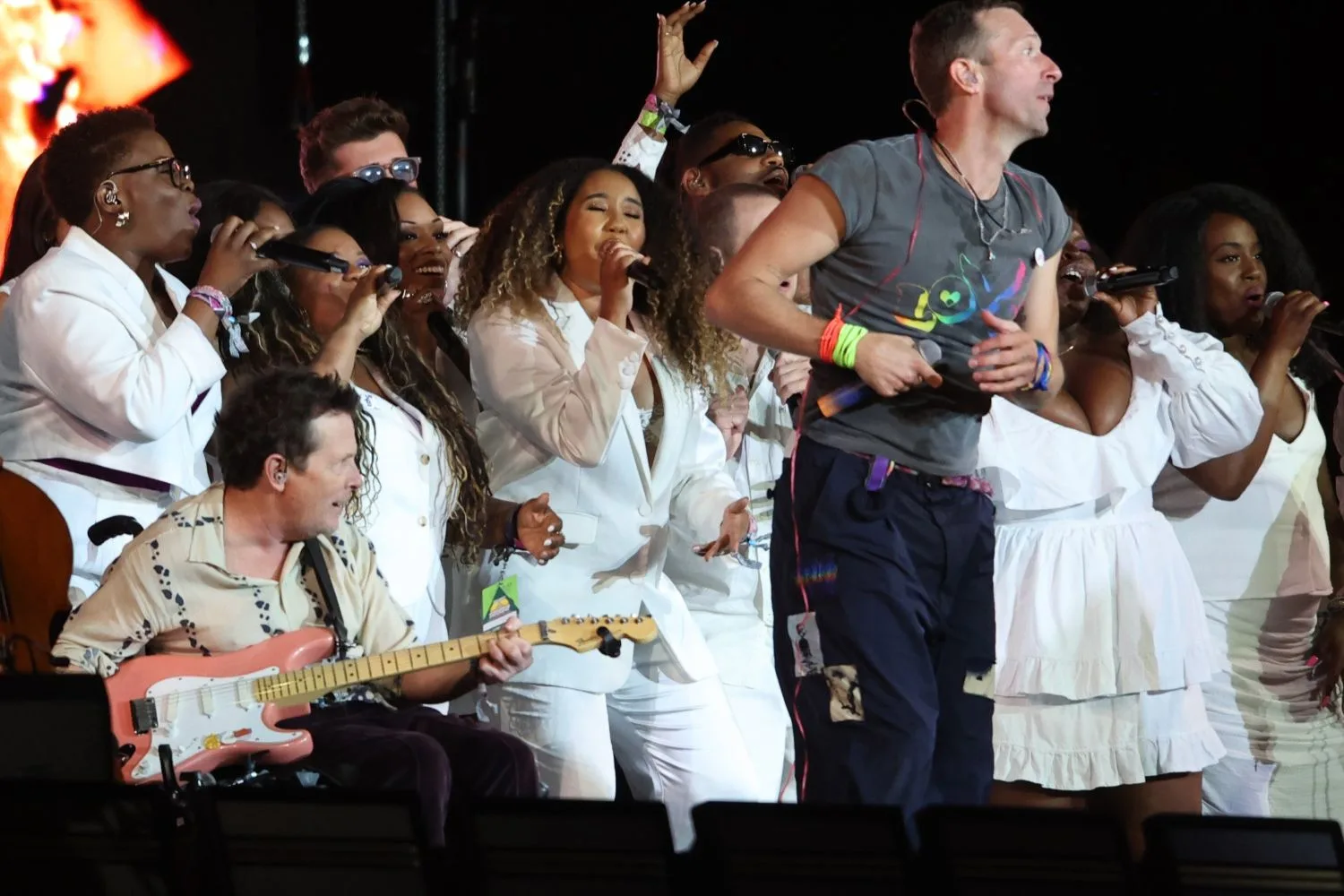Michael J Fox joins Coldplay onstage to perform Fix You.