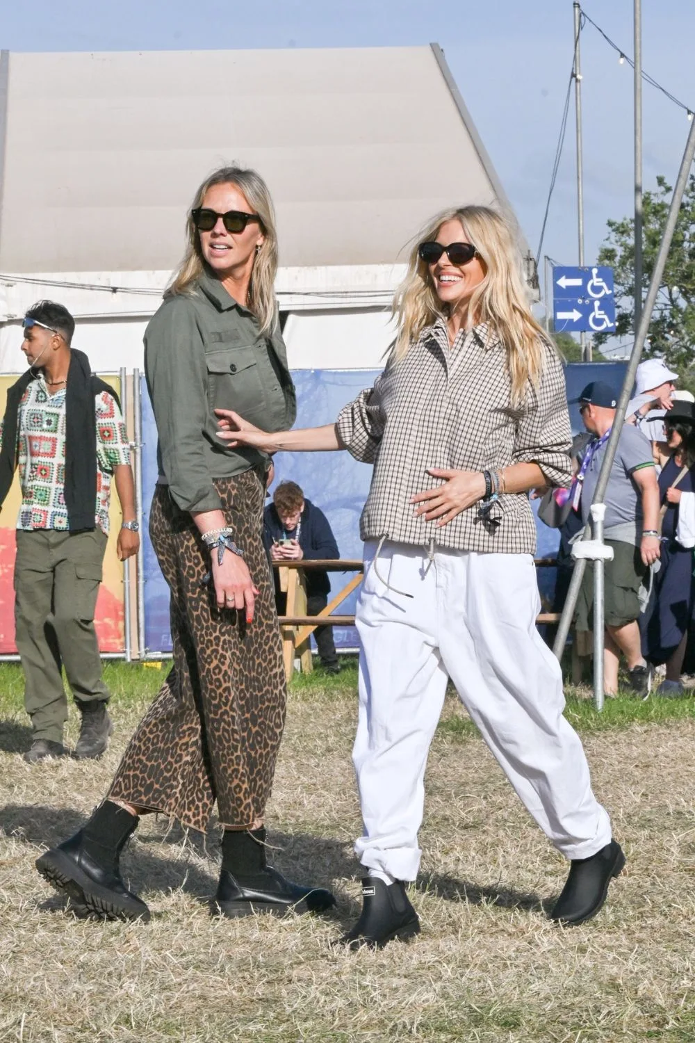 Sienna Miller and a friend looking cool at Glastonbury.