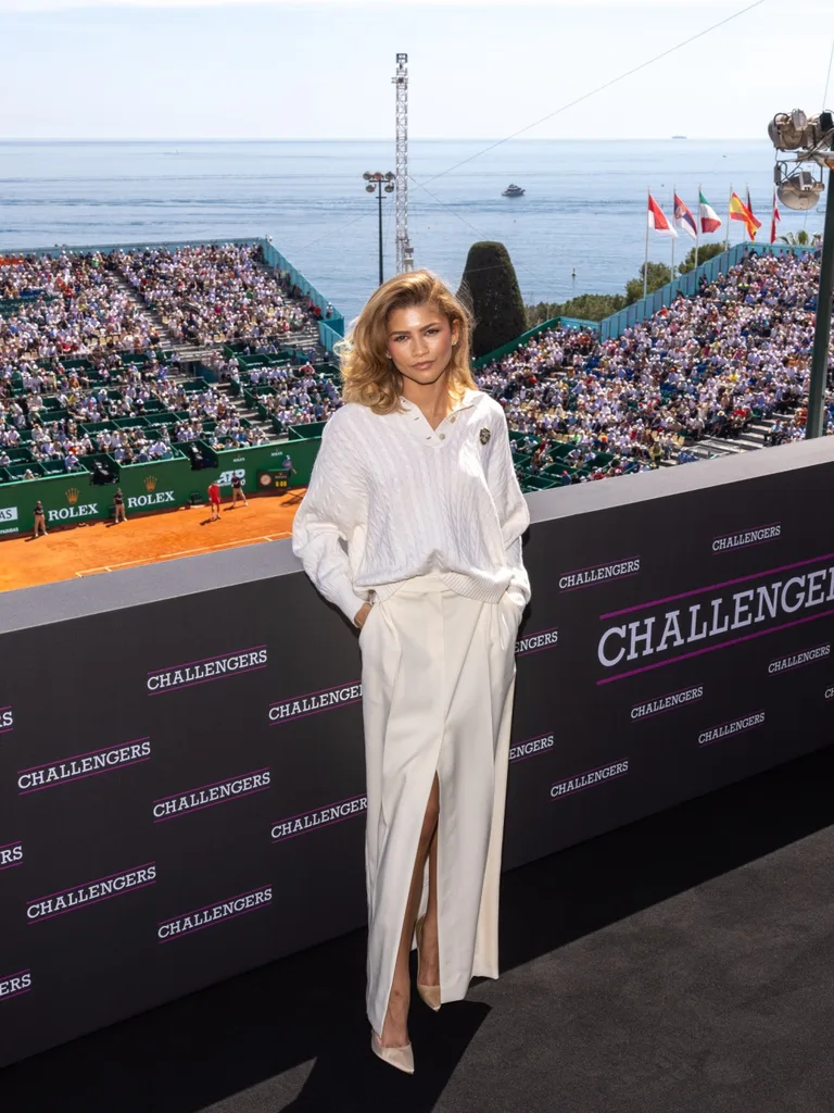 Challengers star Zendaya wearing white skirt and white sweater