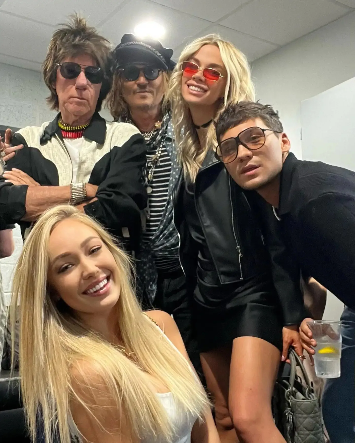 Yulia Vlasova and Johnny Depp with friends