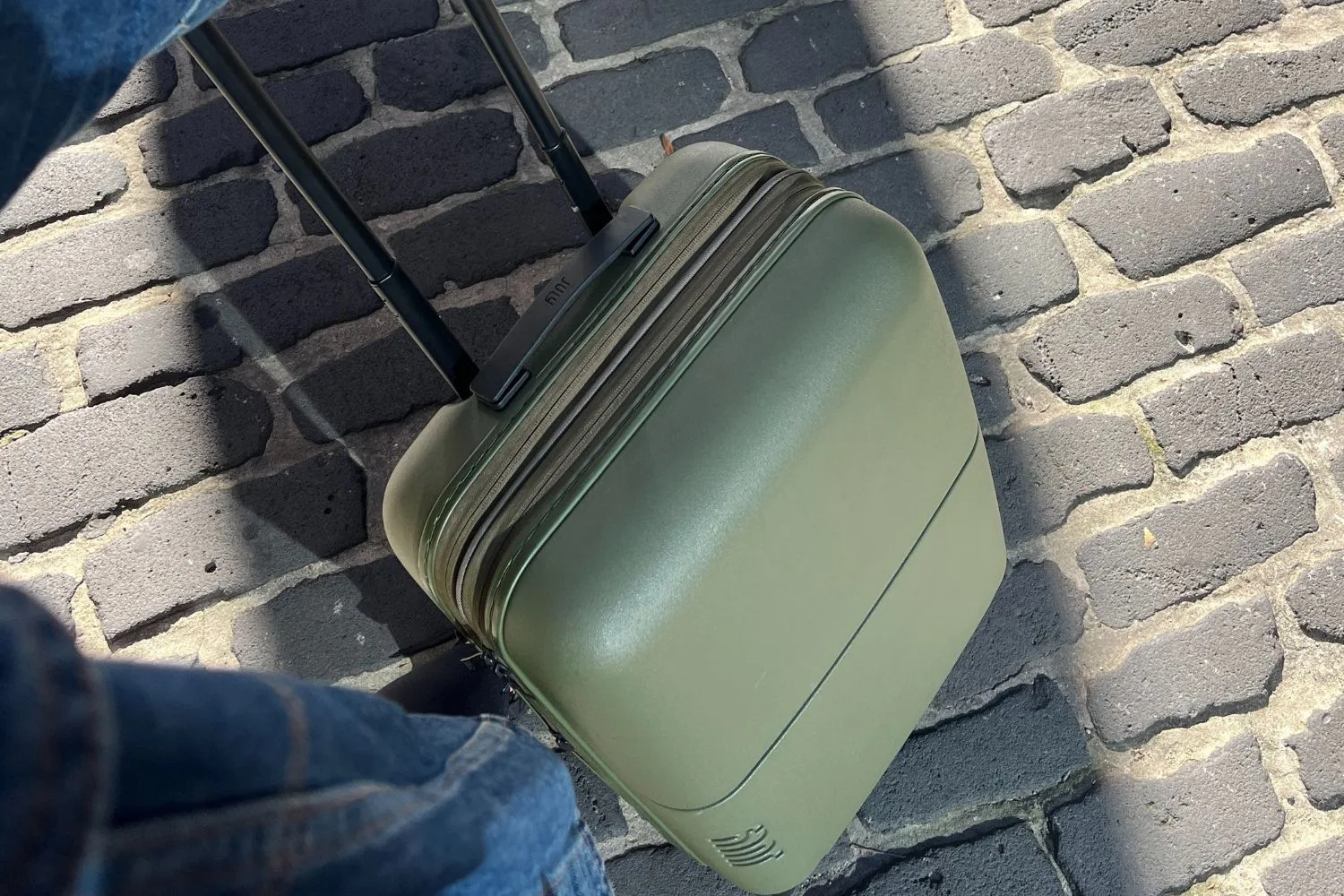 Suitcase on cobblestone pavers