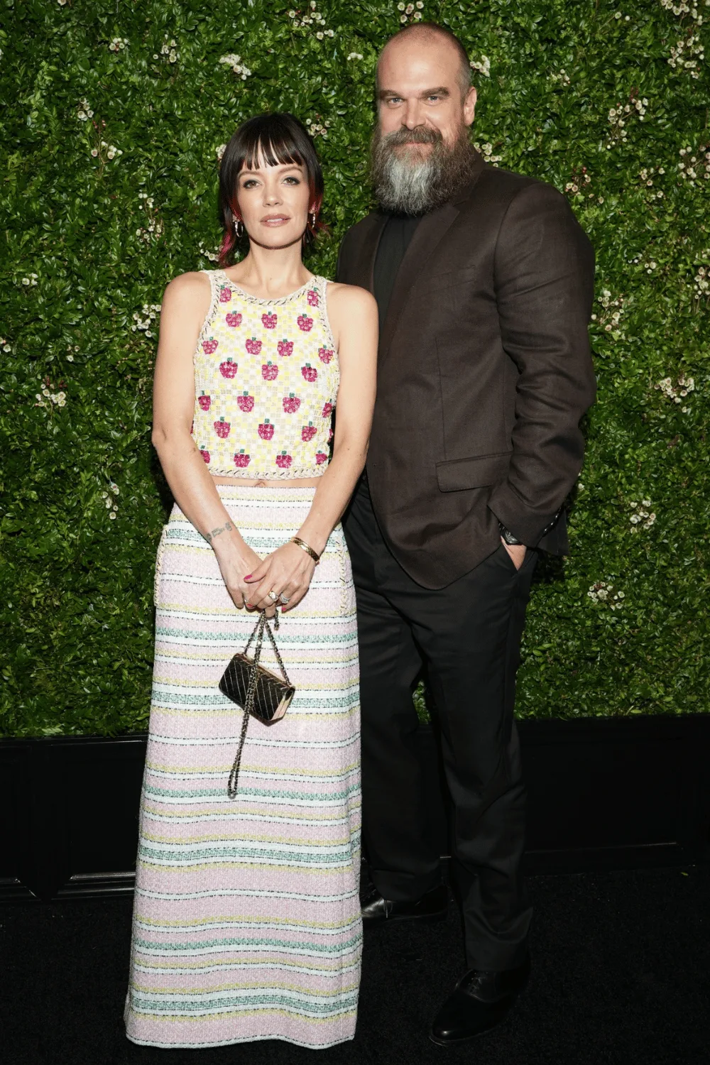 Lily Allen and David Harbour smiling.