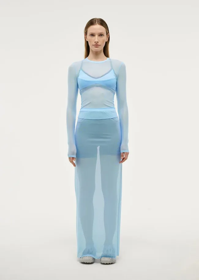 A model wears the Discovery Mesh Midi Skirt