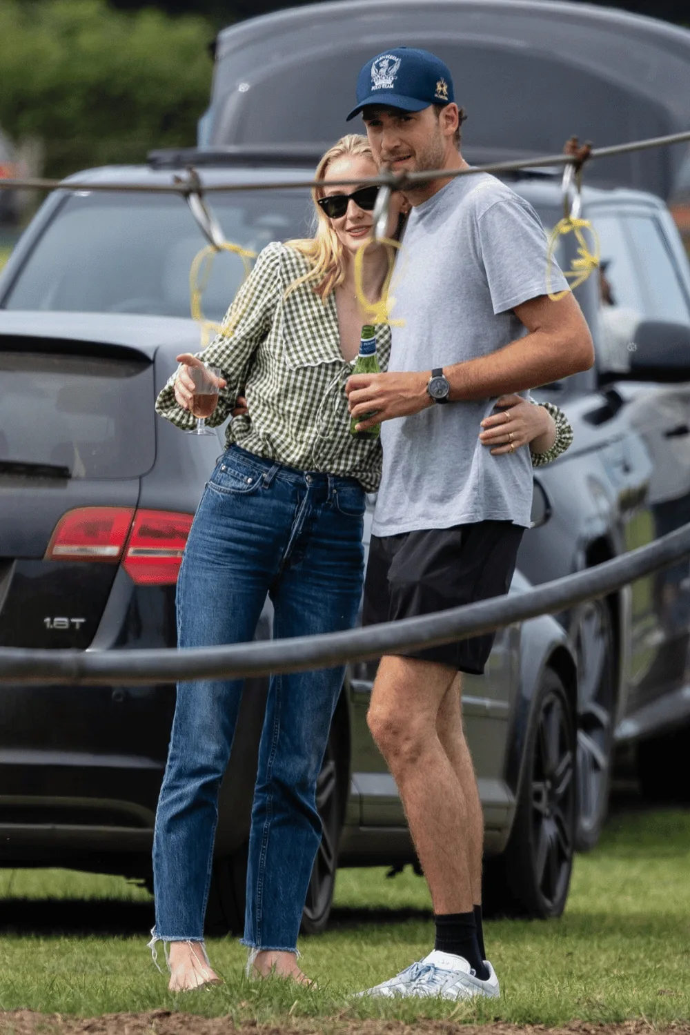 Sophie Turner and Peregrine Pearson hugging.