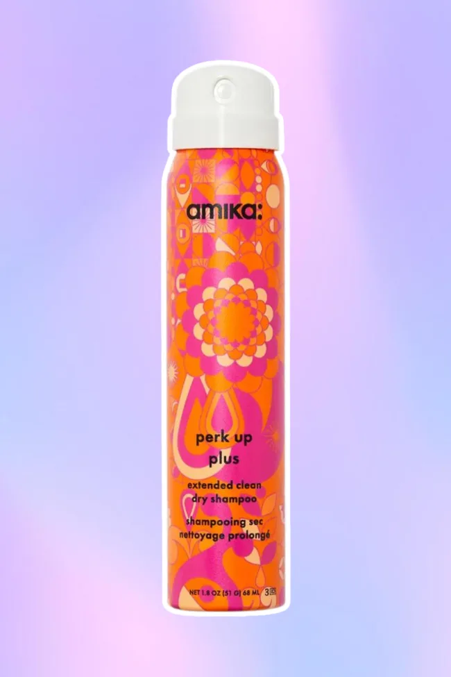 amika perk up plus dry shampoo on purple gradient background