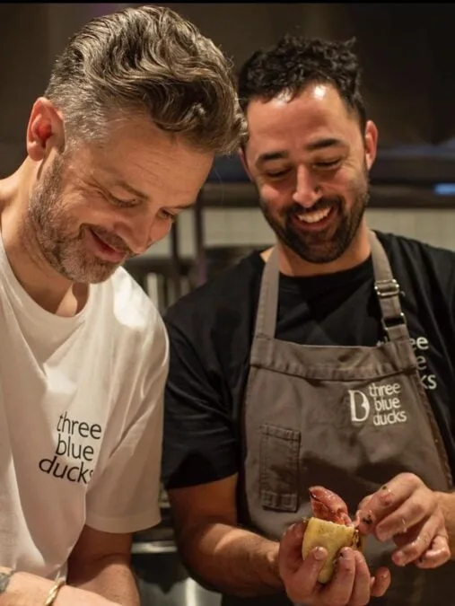 Jock Zonfrillo and Andy Allen cooking together.
