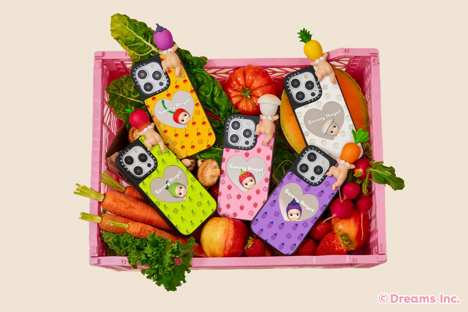 A fruit basket with Sonny Angel phone cases. 