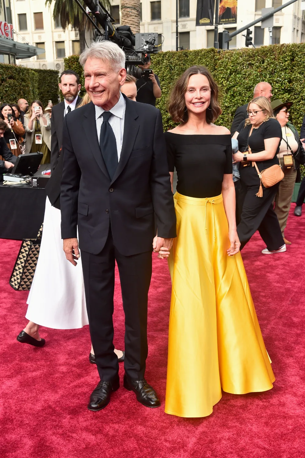 Harrison Ford and Calista Flockhart on a red carpet.
