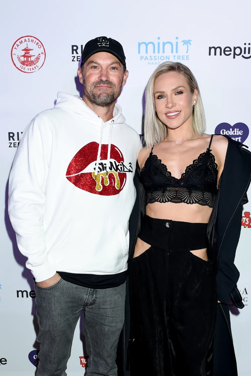 Sharna Burgess and Brian Austin Green at a red carpet event.
