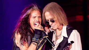 Aerosmith singer Steven Tyler (left) and bassist Tom Hamilton performing live.
