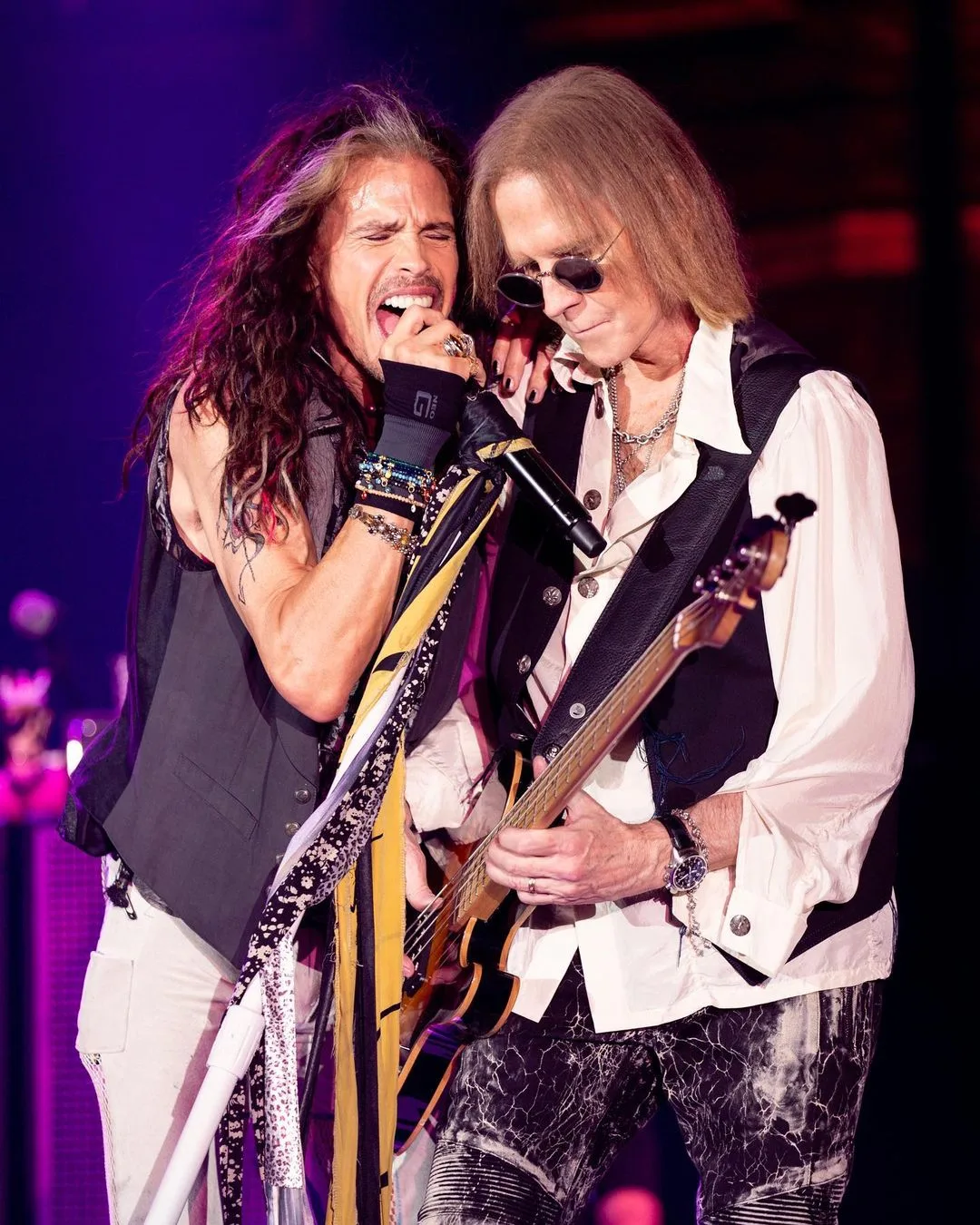 Aerosmith singer Steven Tyler (left) and bassist Tom Hamilton performing live.