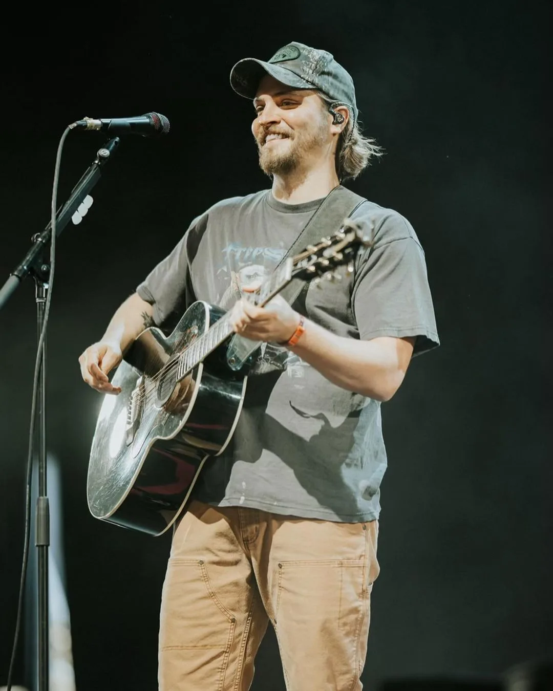 Luke Grimes performing on stage.