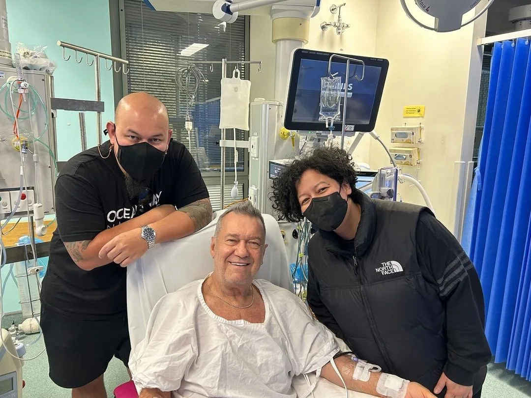 Jimmy Barnes surrounded by family in hospital.