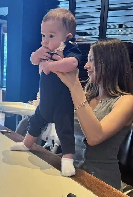 Adrian Portelli's son Mercy pictured at a table