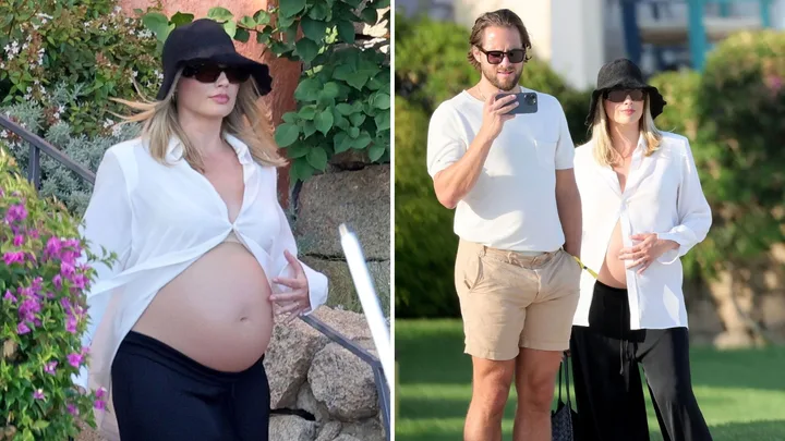 Pregnant Margot Robbie glows in new pics as family details emerge
