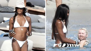 Naomi Campbell in a white bikini on a Mykonos beach with DJ Rampa
